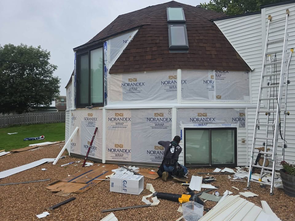 Another unique home getting a complete siding transformation! 🏡🔥

This style of home has plenty of architectural details, curves, angles, and large windows that make siding installation a true craftsmanship job. We’re installing Norandex siding with careful attention to every detail to give this home a clean, updated look while protecting it for years to come.

From the tear-off and weather-resistant wrap to the finished siding and trim — quality installation makes all the difference.

📍 Minnesota & Western Wisconsin
🏠 Roofing • Siding • Windows • Gutters • Decks
📞 763-477-2861
🌐 www.discountsidingandroofing.com⁠￼

Discount Siding & Roofing, Inc. — Locally Owned • Licensed & Insured