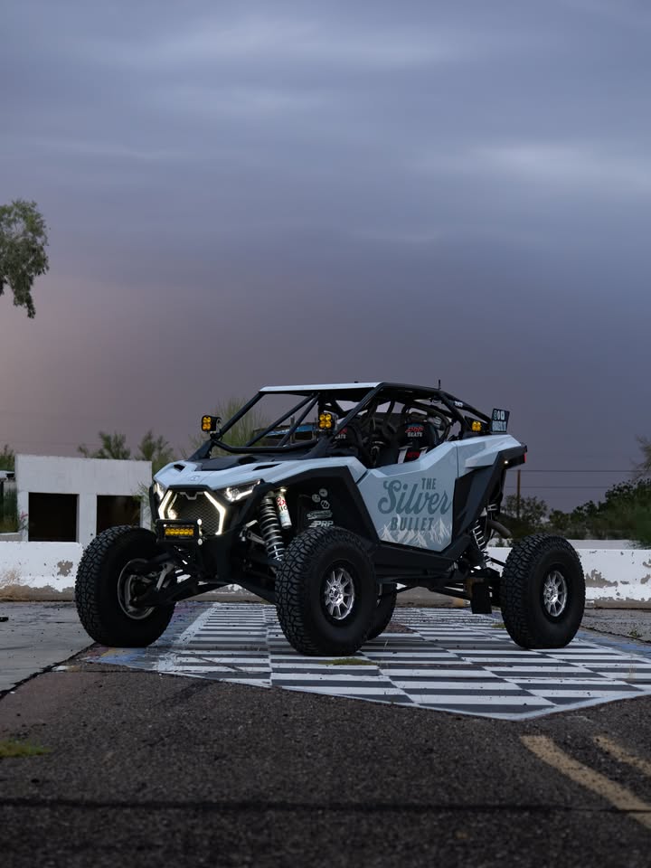 Went out to take some pictures of my 𝙋𝙊𝙇𝘼𝙍𝙄𝙎 𝙍𝙕𝙍 and met a super cool human who got these way cooler shots 😮‍💨
📸 : Michael Nally 

The fine details:
Brick City Fab cage and bumper
Valor Offroad wheels and tires
Dirt Direct Offroad & Motorsports grille, rear bezel, dome light bezel, whip mounts/whips
XTC Power Products fang lights, rock lights, floorboard lights, bed lighting
The Scientists of Lighting pillar lighting, dome light, chase lights, bumper bar
PRP Seats seats, harnesses, doors bags, steering wheel, quick release hub
TERRA CREW steering wheel collab
Axia Alloys various mounts and rear view mirror
PCI Race Radios radio and pumper system
Lowrance Off Road navigation
DRT Motorsports trunk enclosure
Coors Light 🍻
LD FAB tap handle install
A to Z Print Works all decals
AZ WIRE PRO *majority* of wiring and steering wheel controls
Suspension may be changing soon but currently Shock Therapy spring kit 

Blood, sweat, and tears put in by myself, Ricki Bong LD FAB Tieler 
Emotional support put in by Kinsey Richmond Zack Kendra Riegel