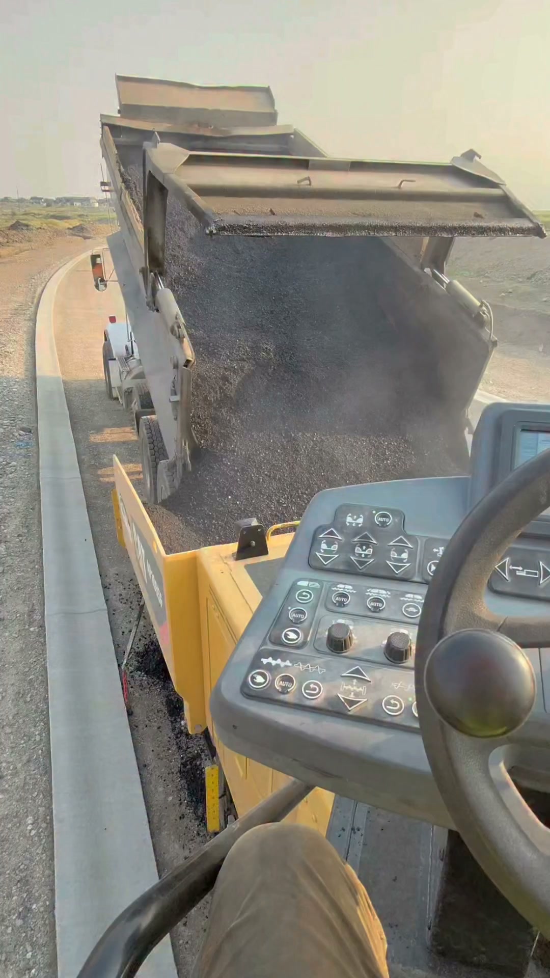 Operating a Cat AP1055 paver.  #raisedonblacktop #roadpaving #asphaltlife #RoadConstruction  High Country Paving, Inc.