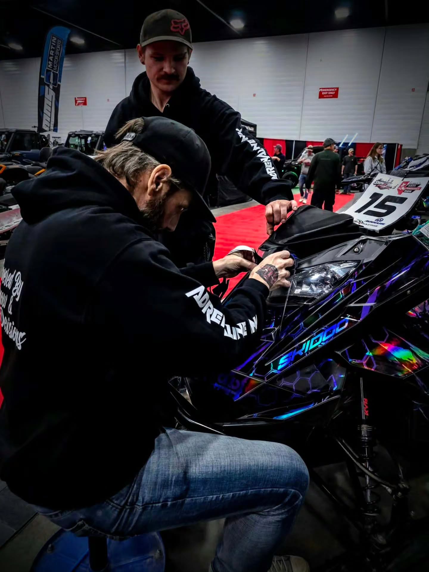 🔥 DAY 1 IS IN THE BOOKS… AND WHAT A DAY! 🔥

We shook some babies, kissed some hands, and had an absolute BLAST at the Adrenaline Ink Show & Shine at the Alberta Powersports Show at the Edmonton Expo Centre! 🤘🏁

Huge THANK YOU to everyone who swung by the booth, said hi, checked out the builds, talked sleds, and helped make Day 1 one hell of a good time. The energy was unreal, and we're just getting started! 🙌

💥 WE'RE BACK TODAY AT 10 AM! 💥

We're wrapping ONE MORE SLED live at the booth, we've still got a TON of prizes to give away, and you've still got a shot at taking something awesome home!

🎁 WHAT THE SLED?! 🎁
Think you know what's hiding inside the tunnel bag? Make your guess and you could WIN! The more obscure your guess, the BIGGER the prize could be. 😈

Come cast your vote, check out the builds, meet the crew, and try your luck. You never know what you might walk away with!

📍 Edmonton Expo Centre
⏰ Doors open at 10 AM

If you missed us yesterday, today's your chance. If you were there yesterday, you already know what's up! 🔥

LET'S MAKE DAY 2 EVEN BIGGER! 🤘
🔥
@albertapowersportshow 
@backcountry.storage.suites
@backusracing 
@tempestoptics 
@gofast_nation 
@shuswapmountainriders 
@shuswapmountainlodge 
@deeplinethrottle 
@ckmemorialsociety 
@tbracing_performance 
@bionicbabelifestyle 
🔥
#AdrenalineInk #ShowAndShine #AlbertaPowersportsShow #EdmontonExpo #SledWraps