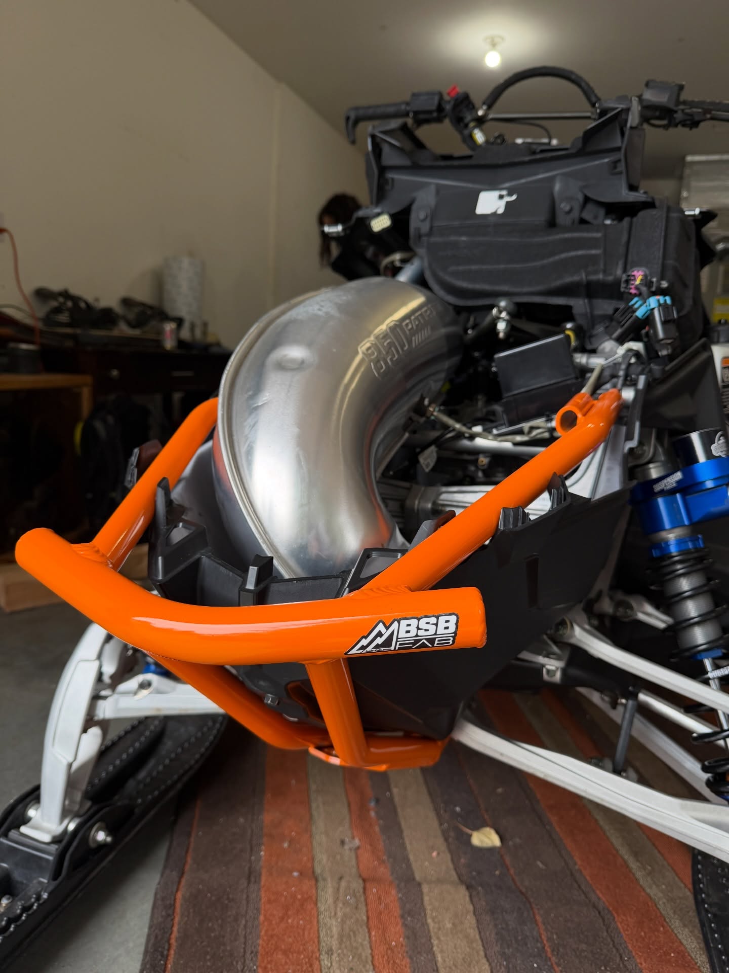 Slowly but surely getting the Khaos build done🤩 I still need to order and put the @deviantink wrap on but we’ve got some time before winter is truly here.

Huge thank you to @ggb_exhaust @suspensionproz and @bsb_fab for having me be a part of their ambassador teams this season. I can’t wait to see this thing finally built out and ripping🫶

• BSB Fab - Orange front and rear bumper(not yet riveted in, need the wrap on first)
• GGB Exhaust - Polaris 850 Quiet Muffler 
• Suspension Proz - Serviced and re-valved shocks (geared towards my weight and riding style) along with the ski shock clamp for extra reservoir safety 

#suspensionproz #ggbexhaust #bsbfab #snowmobiles #polaris