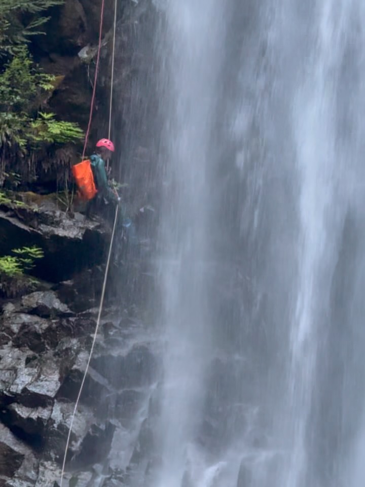 [Yahoo Creek] We are pleased to claim the 3rd recorded descent of this tedious canyon nestled in Lions Bay. This canyon was packed full of log jams, slippery basalt, and less than straightforward rappels which gave way to reveal a truly hidden gem: A 50m waterfall right under the Tunnel Bluffs trail! 

After a long 10 hours spent in a wetsuit, I will never go back there. We placed 6 natural anchors and updated the hardware left on 5 sets of bolts placed in 2015. The canyon should now be easier to run for the next few years. By the time we got to the last rappel, we were nearly out of anchor building material and resorted to double strand rappelling off of a tree 😅. This canyon tested our problem solving ability but luckily Noah and I had been practicing rope skills on a biweekly basis and were able to come up with plans to get us out of a major predicament. I would’ve loved to photograph the 50m waterfall with my DSLR but it took some water damage while taking the photo on the second slide and would not turn on until I dried it out at home.