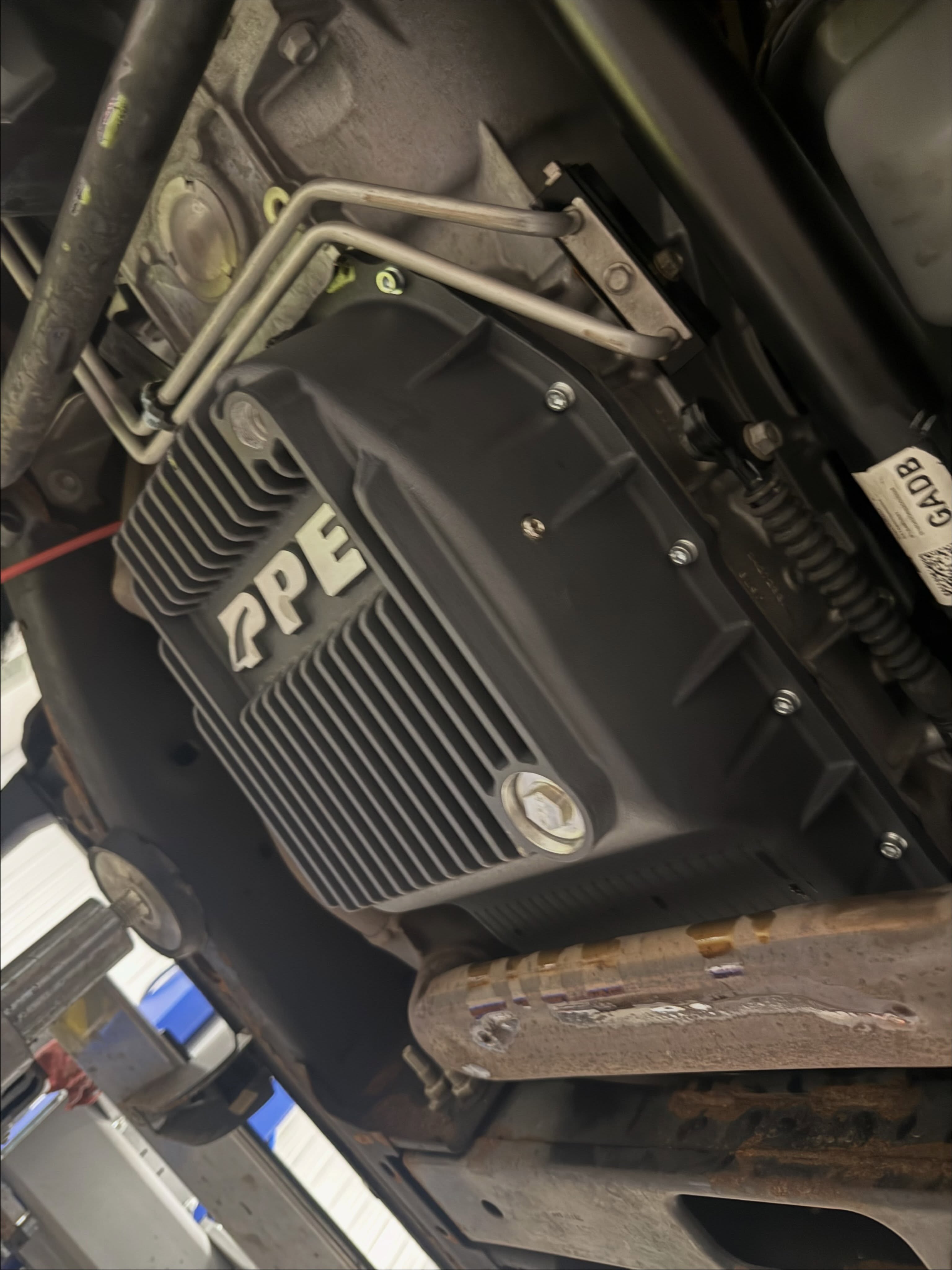 PPE Transmission Pan install along with a PPE Thermostat bypass. Keep this transmission running cool and clean. Reach out, you could use some PPE on your vehicles as well 😎 #ppe #chevy #relentless #performance @ppepower